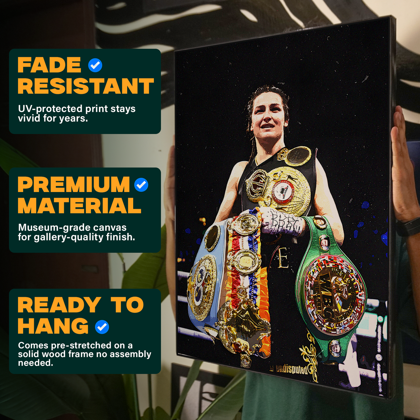 Boxer Katie Taylor holding her championship belts